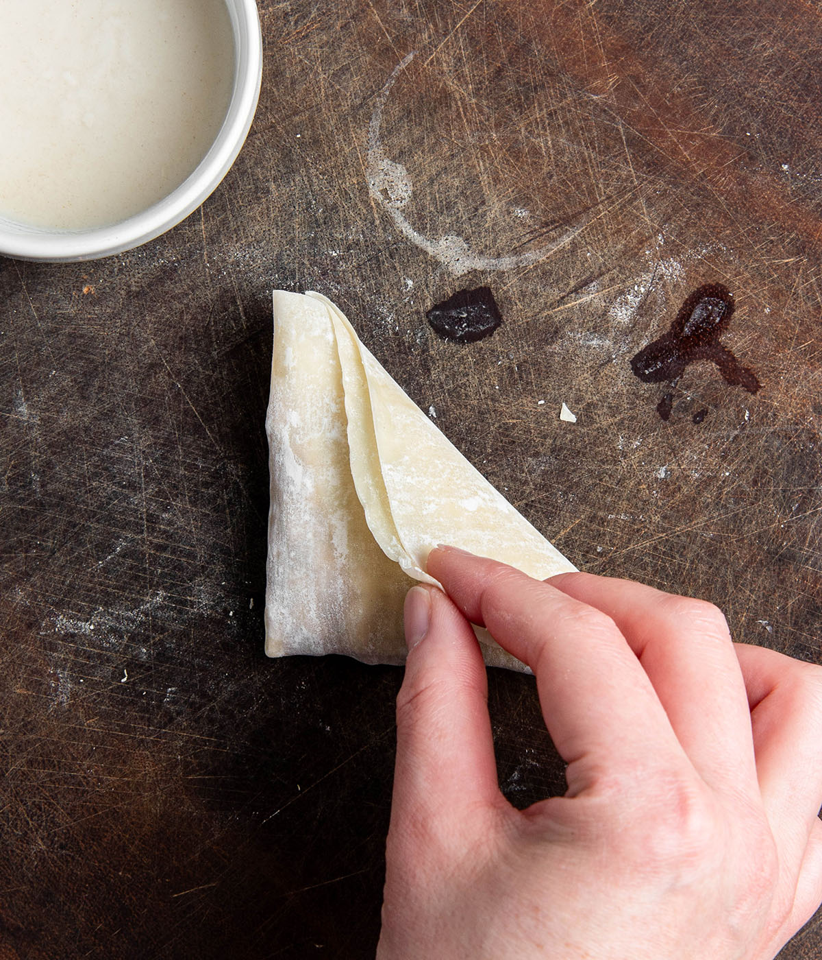 sealing the samosas