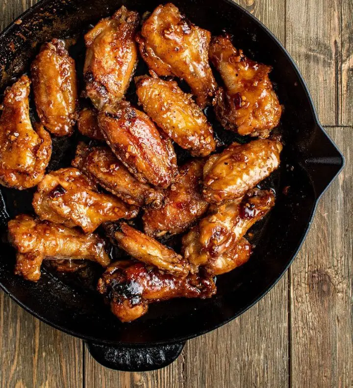 toss chicken wings in sauce