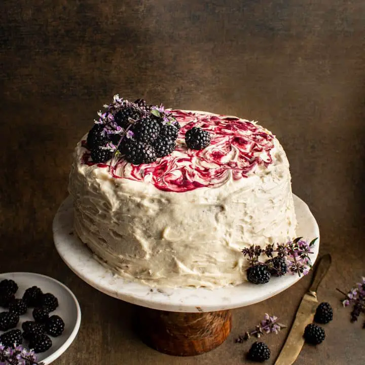 decorate cake with honey buttercream and blackberry curd